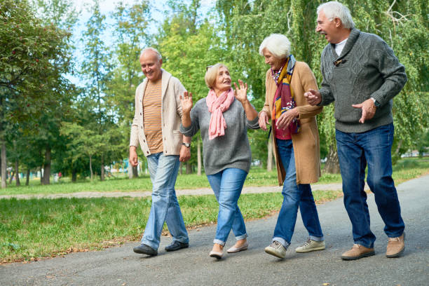 health benefits of walking daily - two senior couples out walking